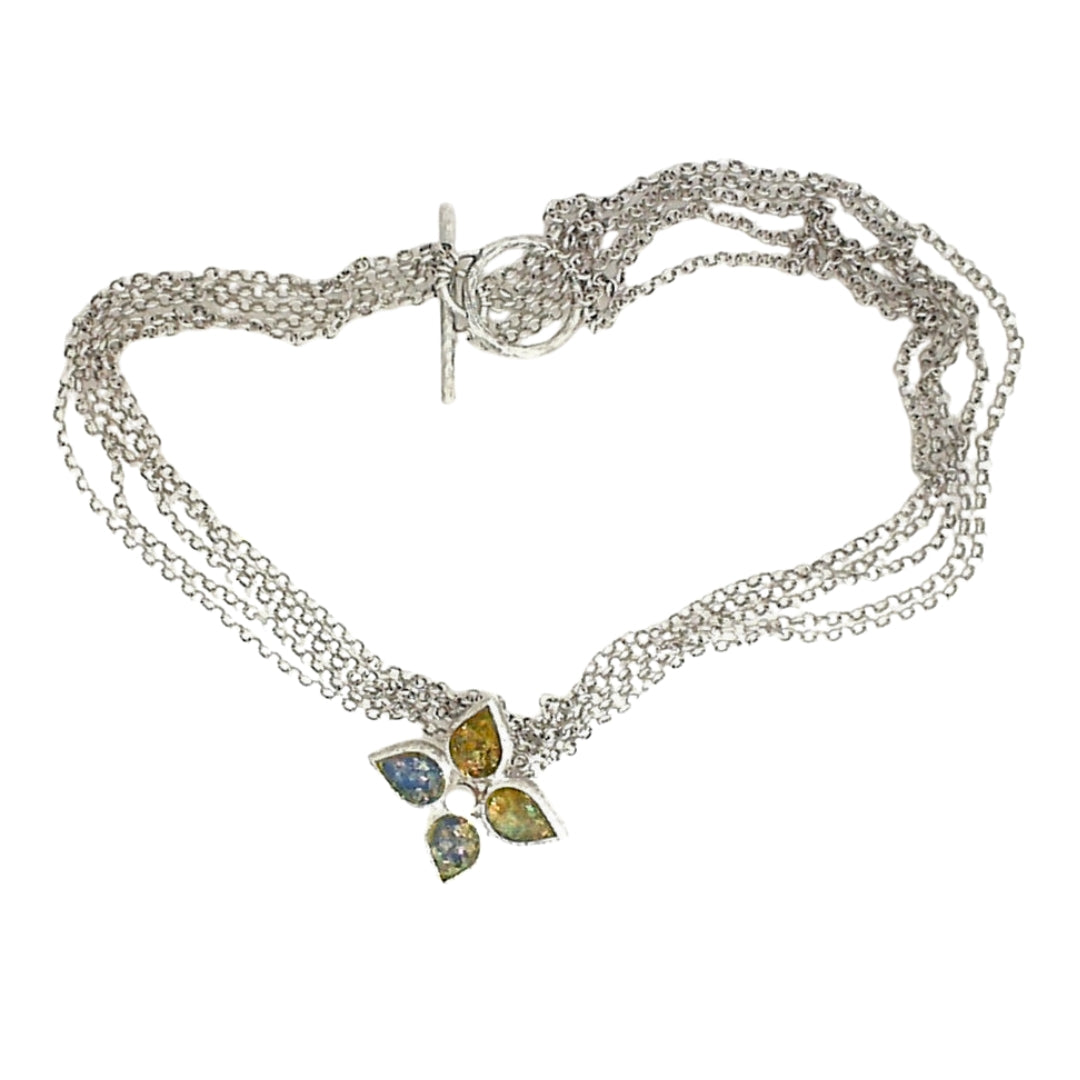 Silver necklace featuring an ancient Roman glass and pearl pendant in a hammered-texture setting, suspended from a five-strand rolo chain with a toggle clasp.