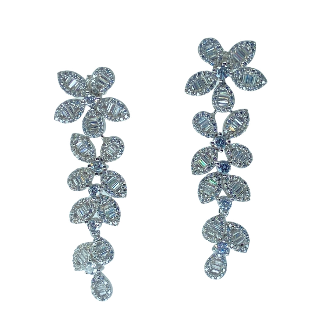 White sterling silver floral drop earrings with baguette and round cz stones in a descending vine pattern.