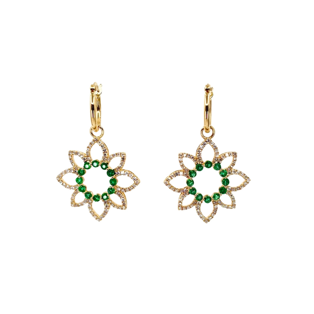 Yellow gold drop earrings in an ornate flower design with petals set with round diamonds and a center circle of vibrant green emearlds.