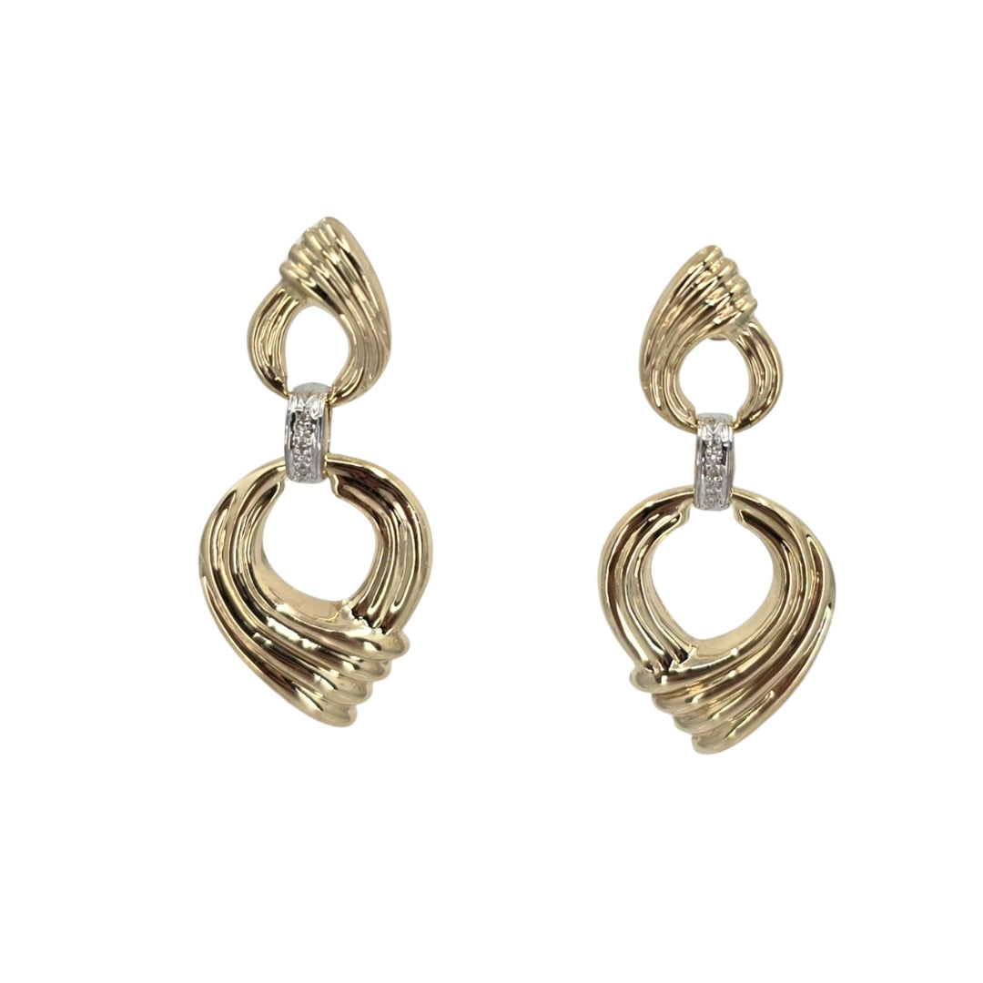 Yellow gold drop earrings with fluted bezel design and set with round diamonds.