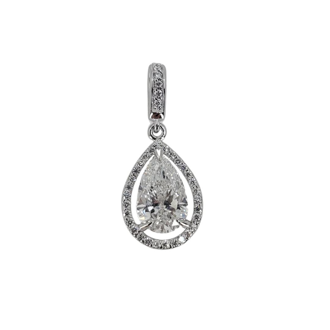 White gold halo pendant centering around a lab grown diamond pendant on a white gold background.