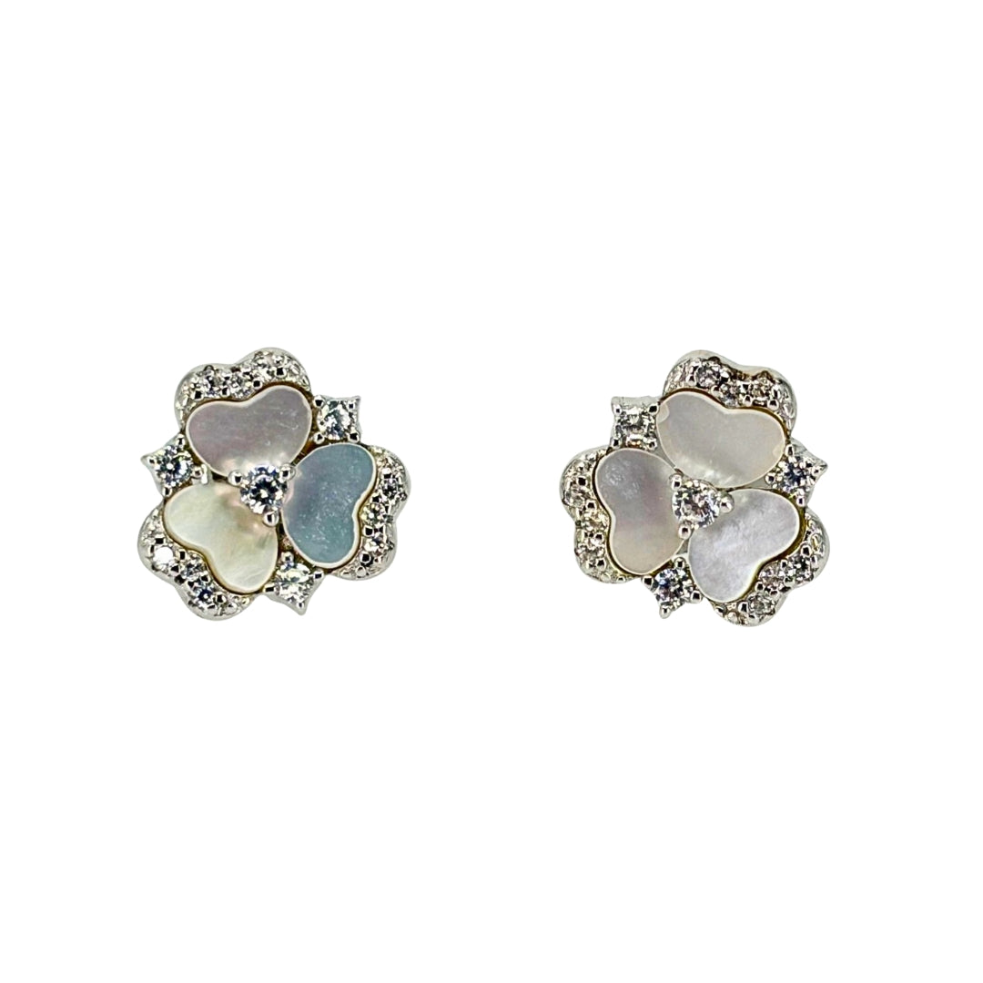 White silver stud earrings set with overlapping mother of pearl and cz petals in a button flower shape.