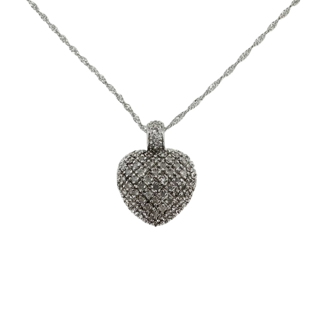 White sterling silver heart pendant completely set with round diamonds on a twisting white sterling silver chain.