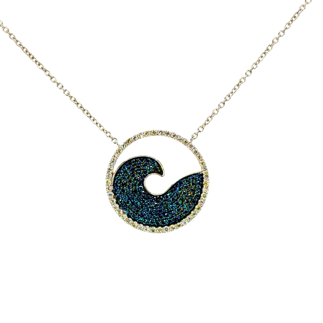 White gold necklace featuring a circular pendant with a sparkling blue diamond wave design, outlined with white diamonds.