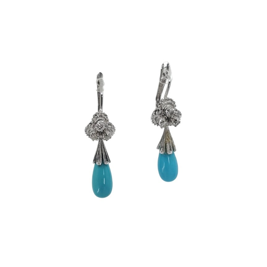 White gold drop earrings with pear shaped turquoise stones.