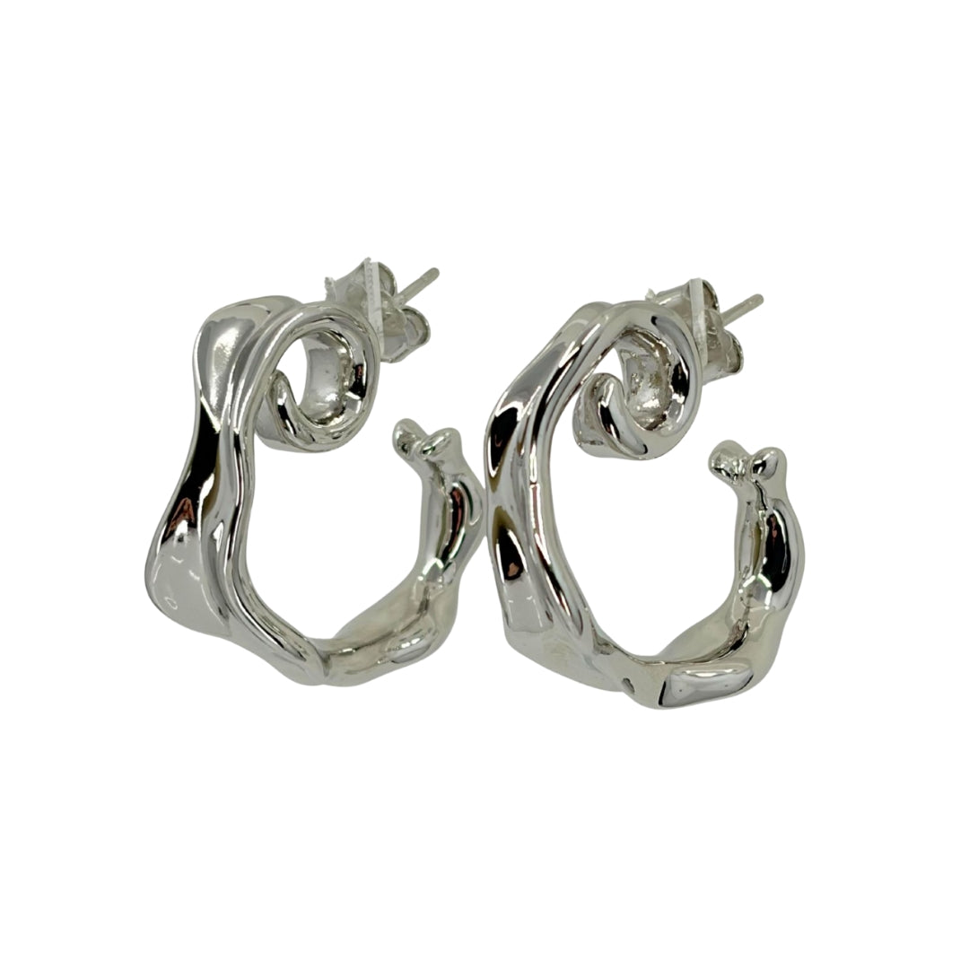 White silver hoops in a flowing geometric spiral shape.