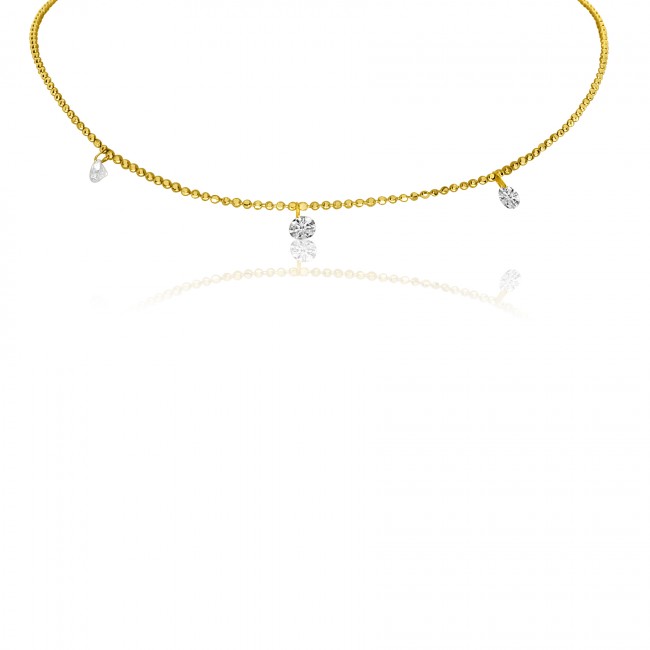Yellow gold beaded chain with three round station diamonds set equal distances apart.