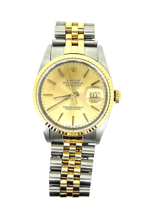 Two tone gold and steel Rolex Datejust watch with date display on dial and Jubilee bracelet