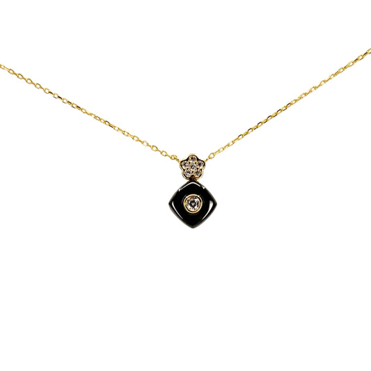 Yellow silver necklace with a black square drop pendant accented by a bezel-set cubic zirconia center.
