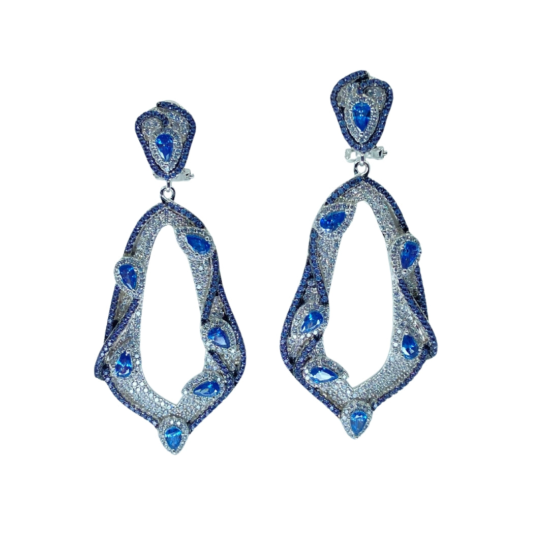 White sterling silver drop earrings featuring blue and white cubic zirconia stones in a graceful dangling design.