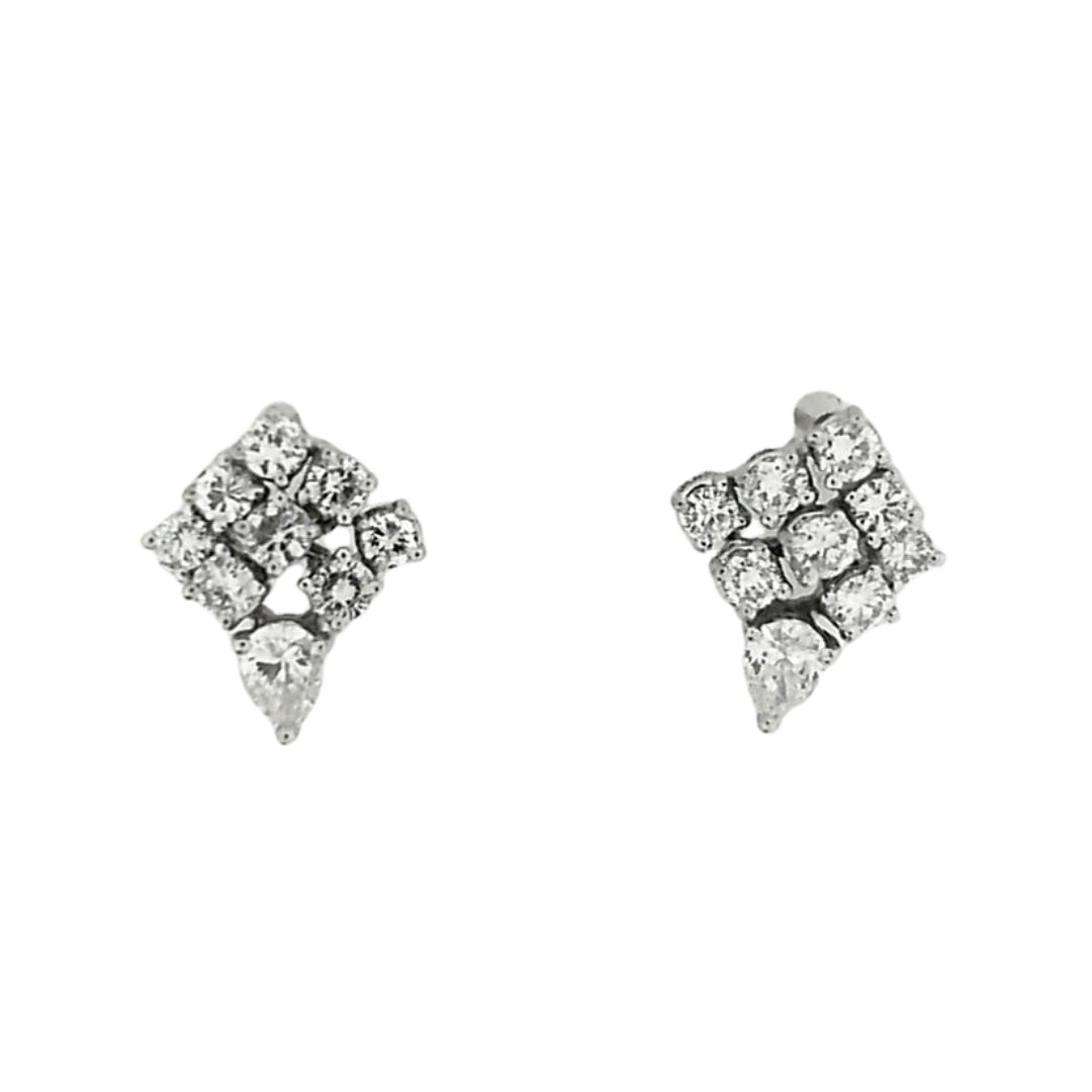 White gold earrings in a shield shape set with a bottom pear diamond and 9 round diamonds per earring.