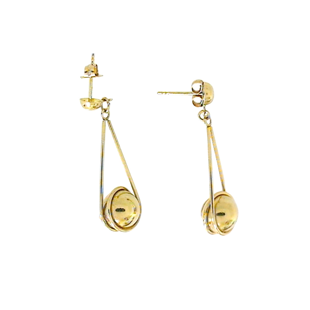Yellow gold drop earrings with ball suspended by a wire.