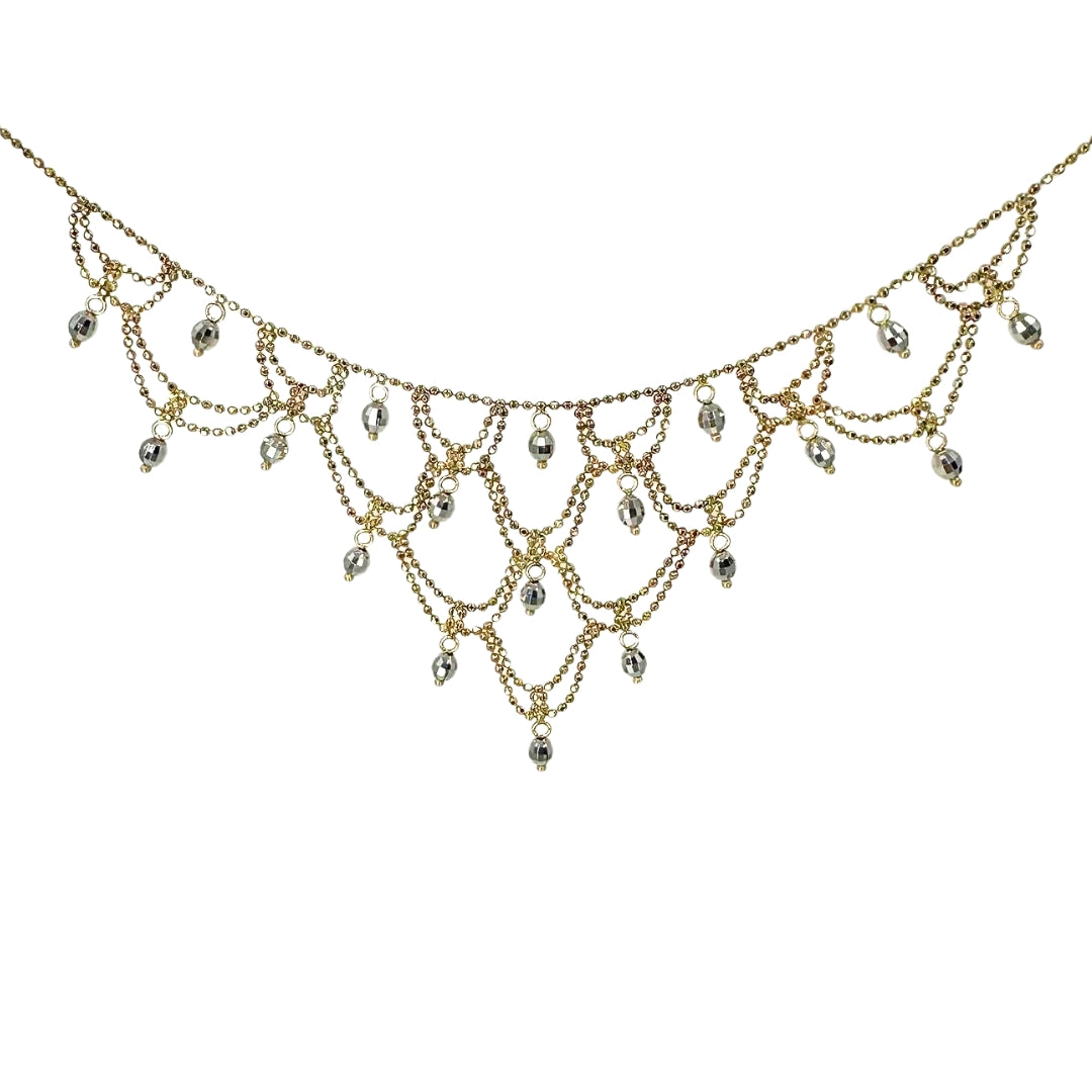 Cascading yellow gold beaded necklace with looping layers and white gold beads hanging in the loops.