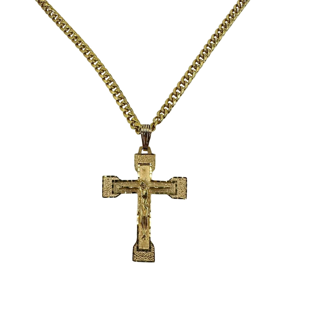 Yellow gold crucifix pendant on a yellow gold Cuban chain.