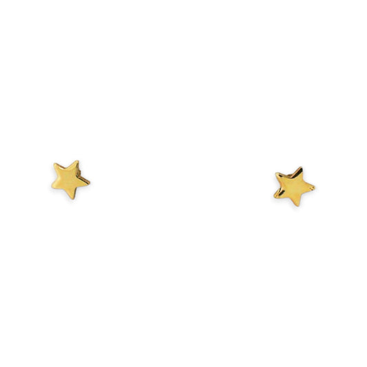 Mini yellow gold star earrings on a white background.