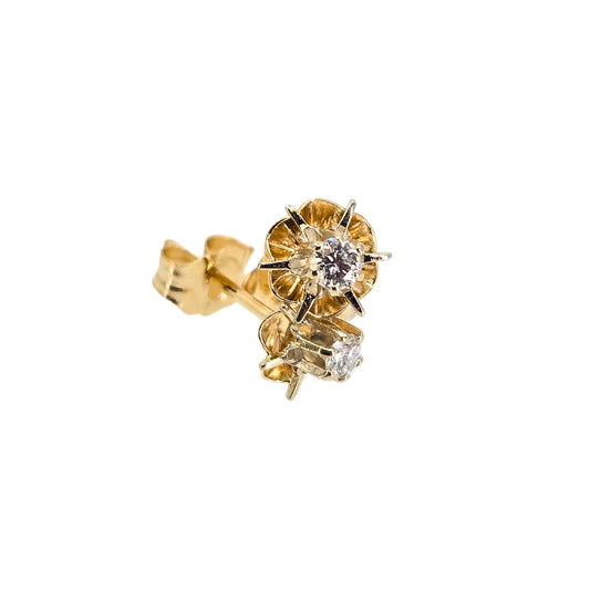 Round diamond stud earrings set in a yellow gold buttercup design.