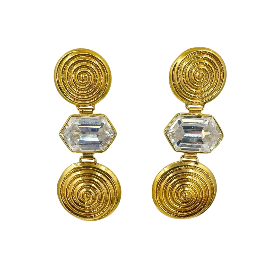 Yellow gold earrings with two descending large spiraling circles with a large rectangular hexagon shaped cz stone between them each.