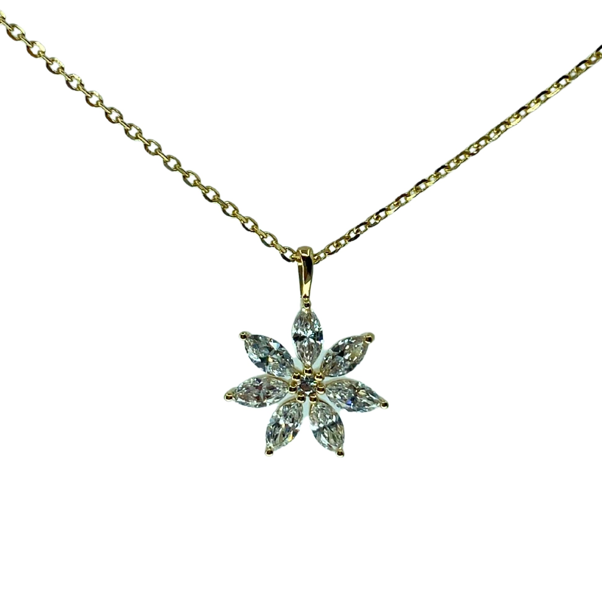 A yellow gold pendant with a flower design, adorned with marquise-cut diamonds, accompanied by an 18-inch gold chain.