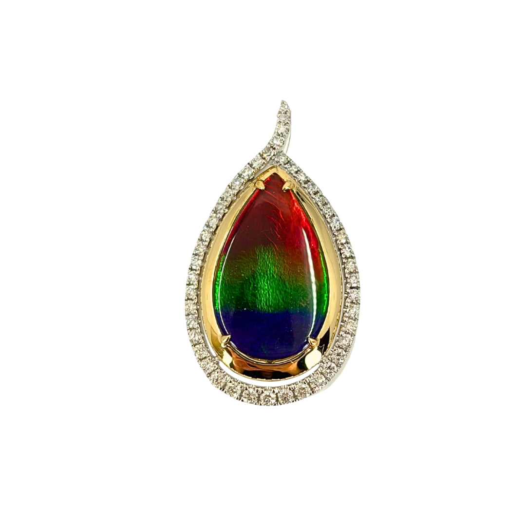 Gold pendant with a halo of white gold and round diamonds and a centerpiece of a vibrant pear ammolite stone set in yellow gold.