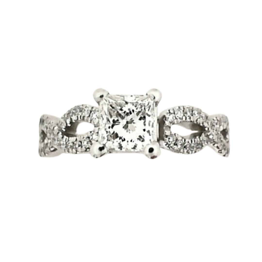 Platinum infinity-style engagement ring featuring a 0.65 carat princess-cut center diamond and round diamond accents along an elegant infinity-inspired band.