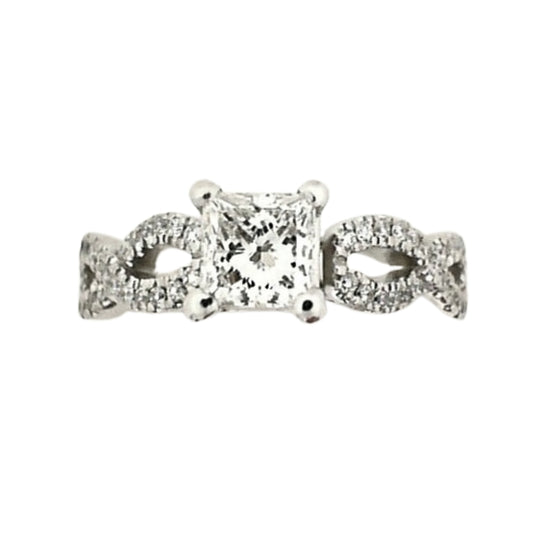 Platinum infinity-style engagement ring featuring a 0.65 carat princess-cut center diamond and round diamond accents along an elegant infinity-inspired band.