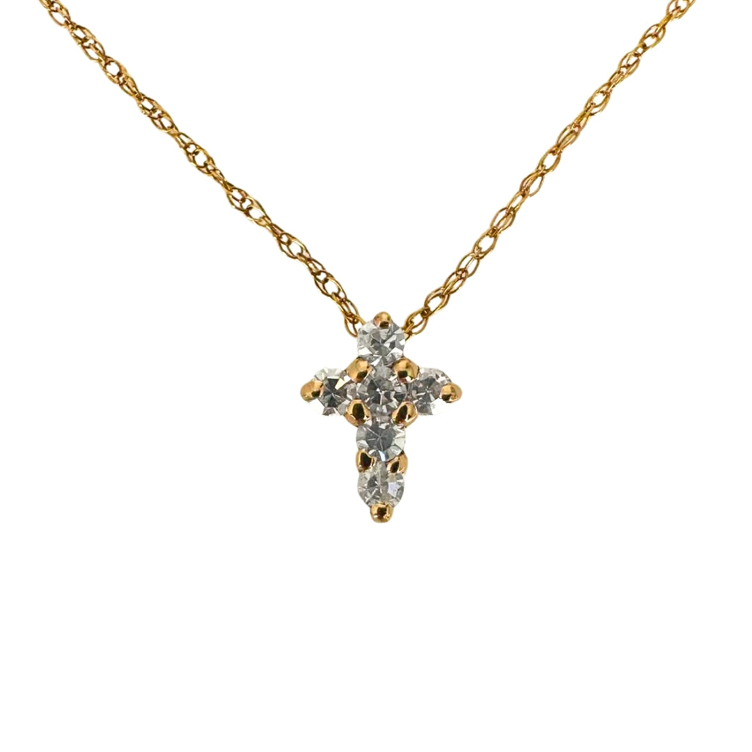 Rose gold cross pendant set with six round diamonds.