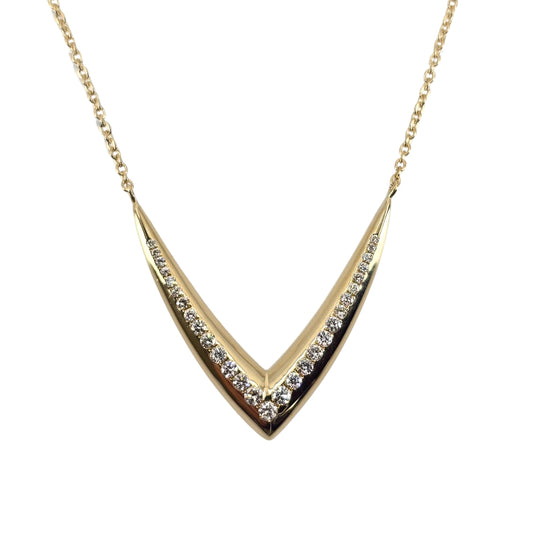 Yellow gold vee shaped necklace with a delicate vee of round diamonds in the center.