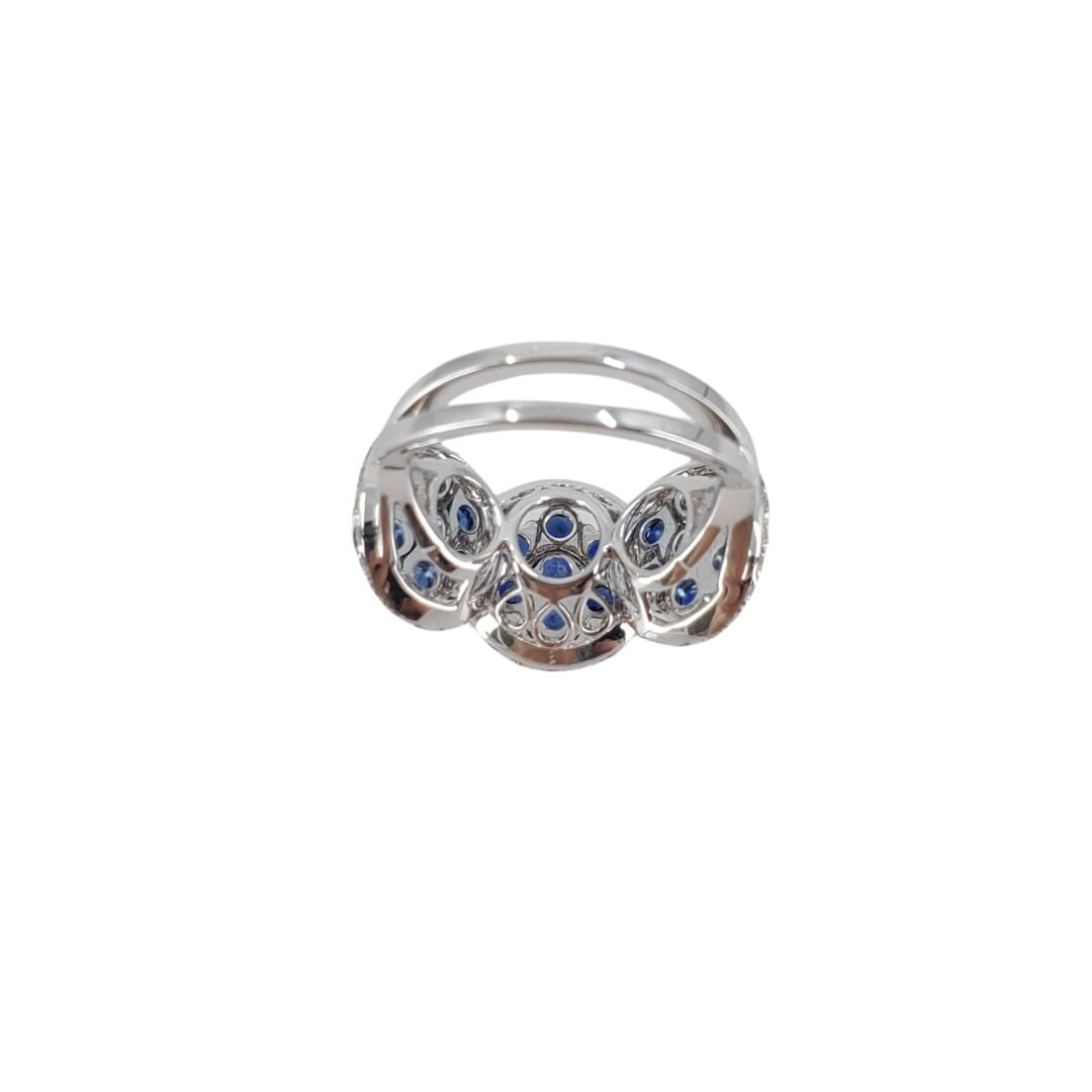 18 karat white gold ring with 21 round sapphires and 56 diamonds set in a triple cluster design back view