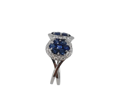 18 karat white gold ring with 21 round sapphires and 56 diamonds set in a triple cluster design side view