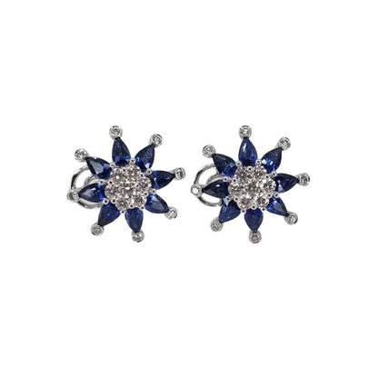 18 karat white gold omega clip earrings with 16 marquise sapphires and 30 round diamonds