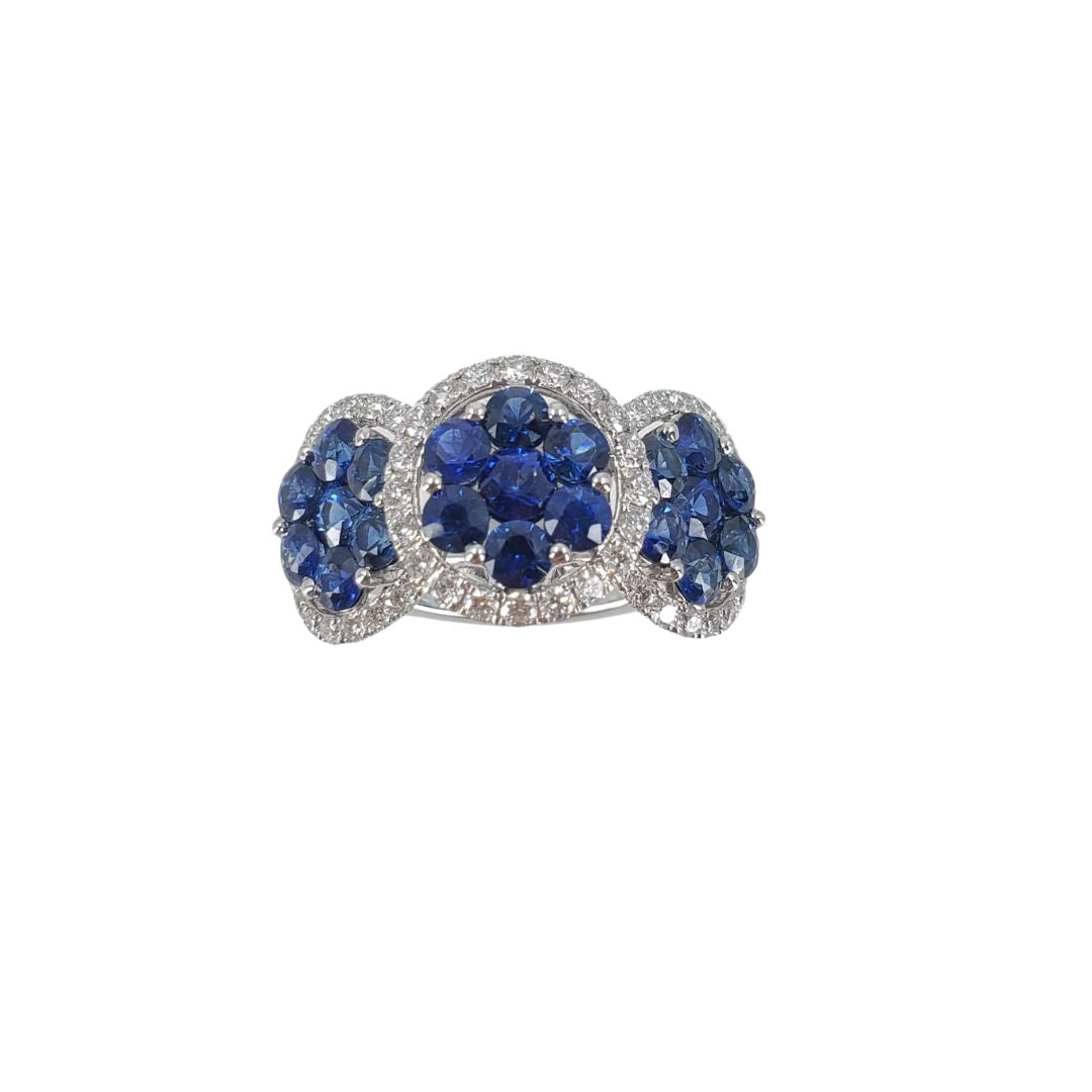 18 karat white gold ring with 21 round sapphires and 56 diamonds set in a triple cluster design