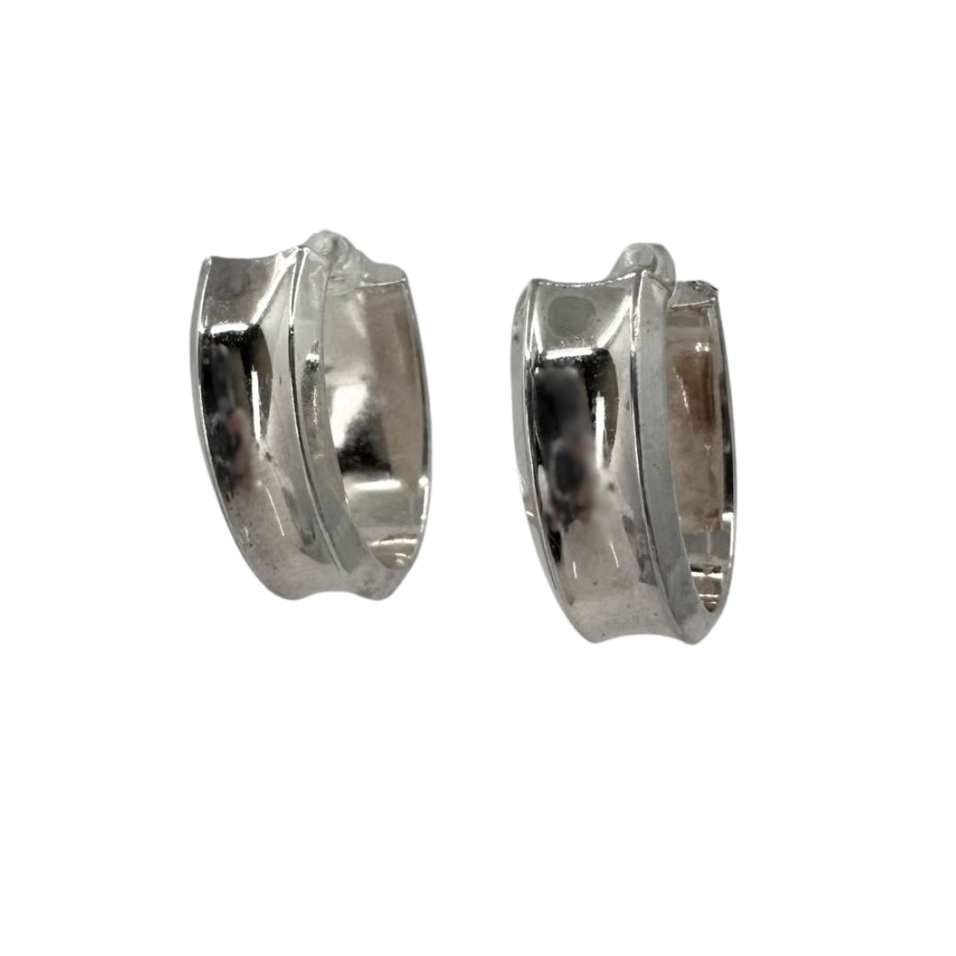 Wide white silver hoop earrings in an oval shape with a concave design.