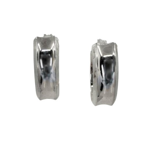 Pair of wide silver hoop earrings with a concave center design.