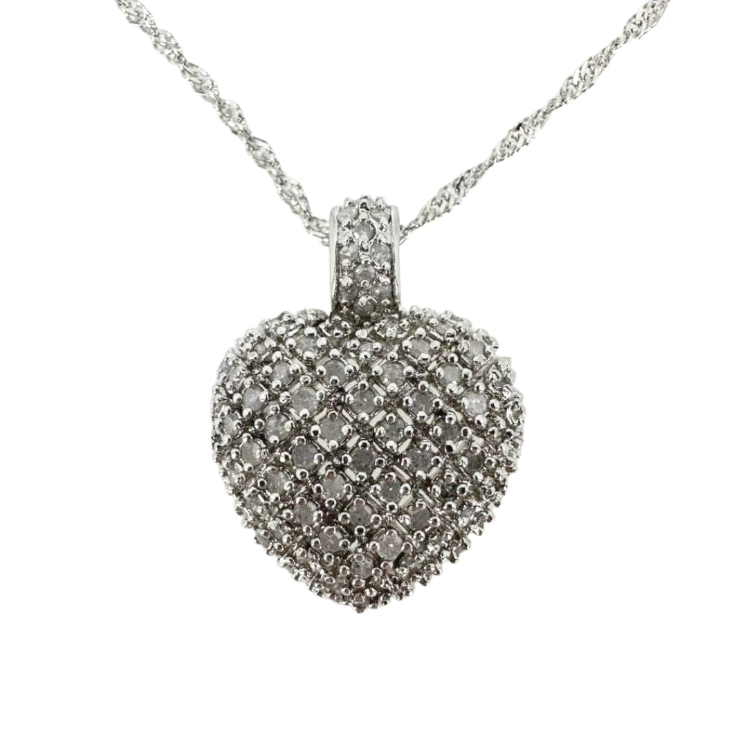 White sterling silver heart pendant completely set with round diamonds.