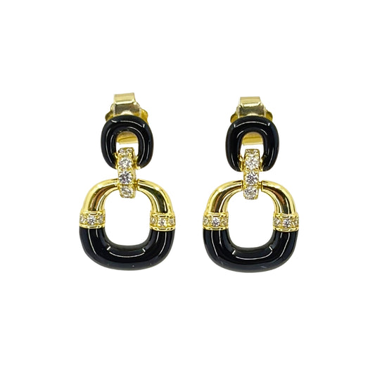 Yellow silver earrings with two descending ovals connected by a cz covered bail and black enamel detailing on the lower half of the ovals.