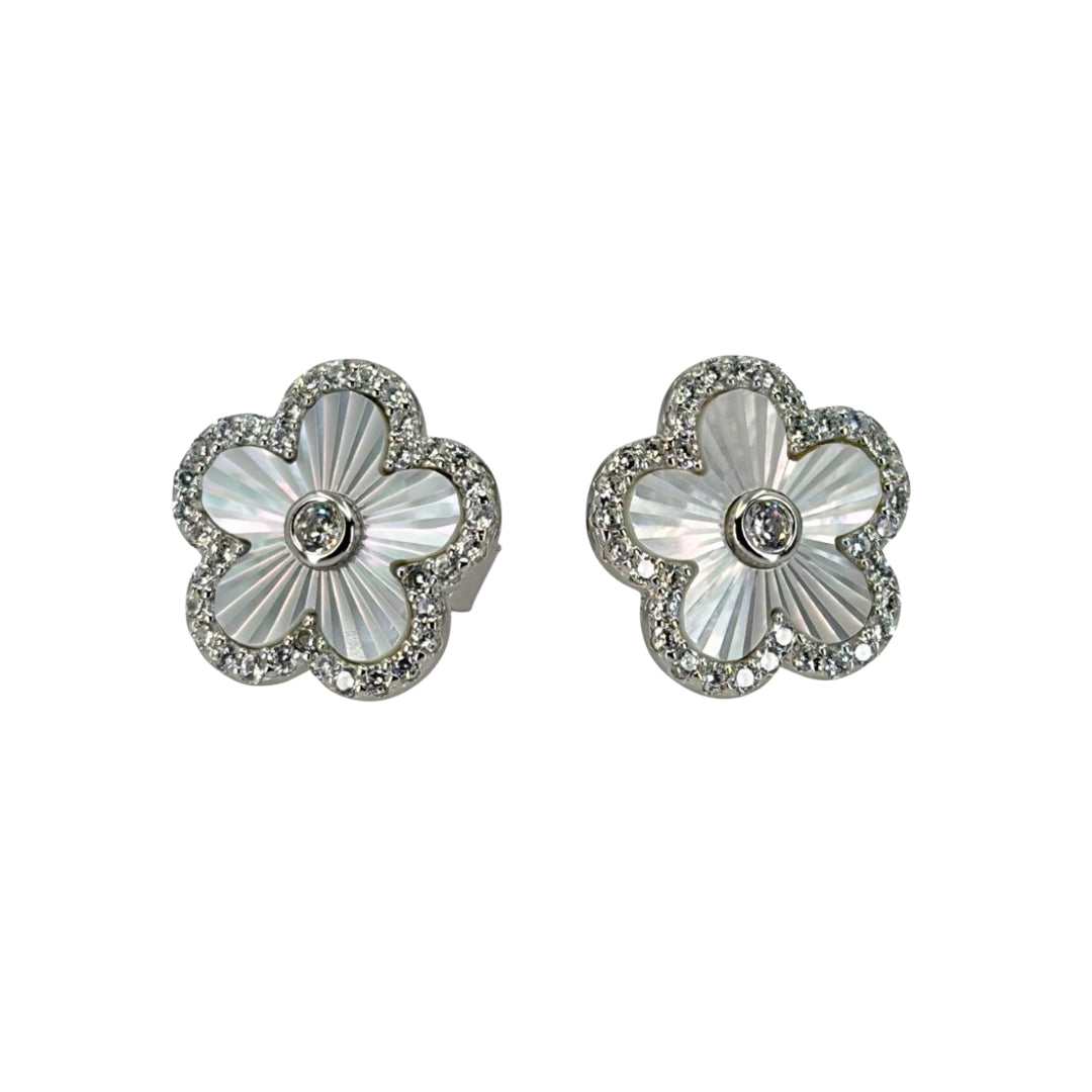 White silver earrings set with quatrefoil mother of pearl and outlined with shimmering cz stones.