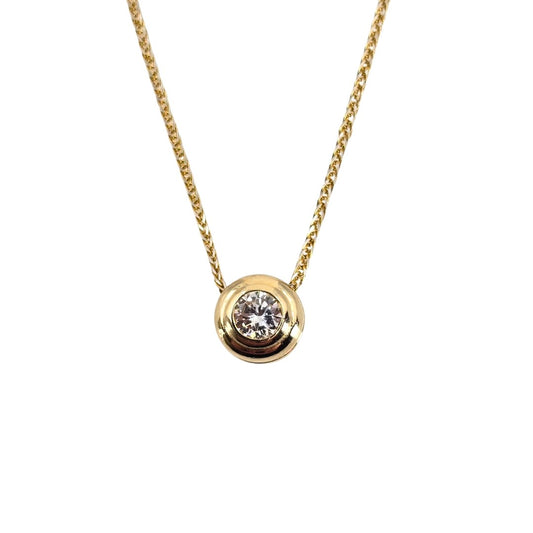 Yellow gold necklace with a central sparkling diamond stone in a yellow gold bezel setting.