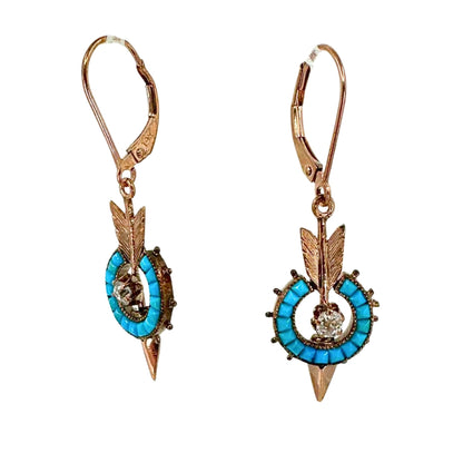 Rose gold arrow earrings with a halo of turquoise stones and a center old mine cut diamonds.