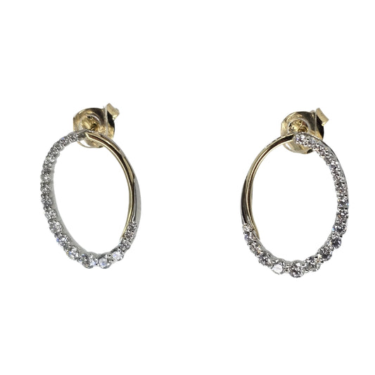 Two tone gold oval earrings with diamonds set on the outside edges of the oval.