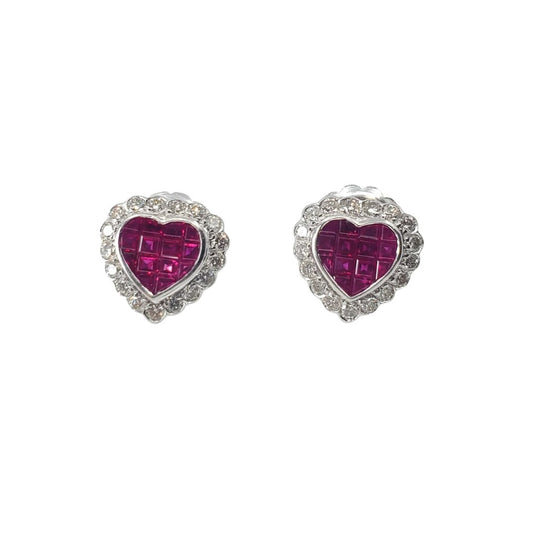 White gold heart shaped stud earrings set with a ruby center and an outer circling of diamonds.