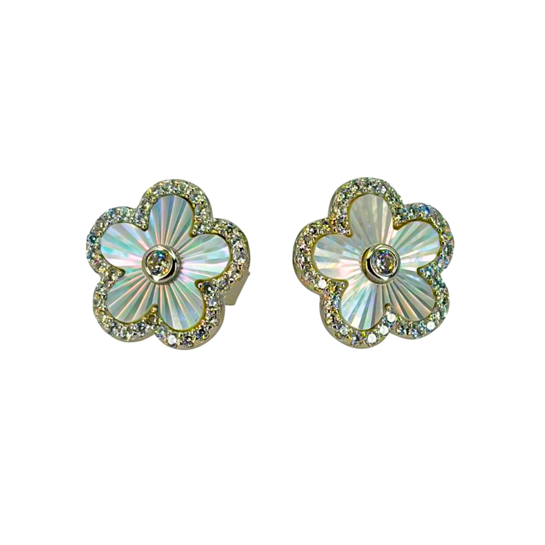 Yellow silver quatrefoil shaped post earrings set with luminous mother of pearl and outlined with shimmering cz stones.